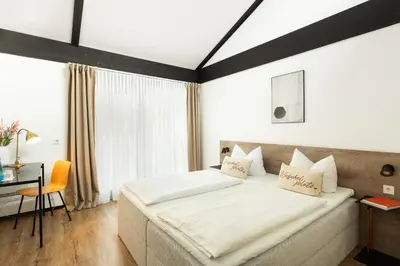 Ein Bett oder Betten in einem Zimmer der Unterkunft Hotel My Schildow