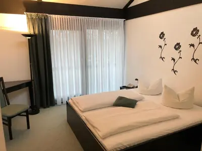 Ein Bett oder Betten in einem Zimmer der Unterkunft Hotel My Schildow