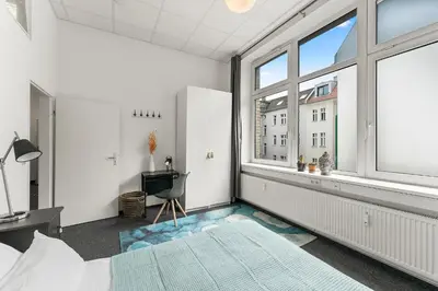Ein Bett oder Betten in einem Zimmer der Unterkunft Holiday 33 Apartments ABCD Alexanderplatz