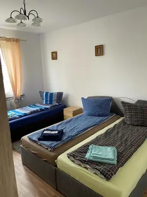 Ein Bett oder Betten in einem Zimmer der Unterkunft LEKOMA Pension