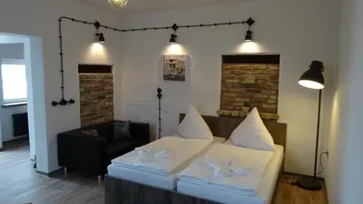 Ein Bett oder Betten in einem Zimmer der Unterkunft Gästehaus Strausberg