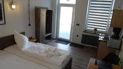 Ein Bett oder Betten in einem Zimmer der Unterkunft Gästehaus Strausberg