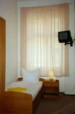 Ein Bett oder Betten in einem Zimmer der Unterkunft Pension Wedding