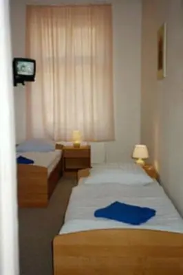 Ein Bett oder Betten in einem Zimmer der Unterkunft Pension Wedding