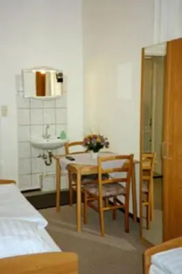 Ein Bett oder Betten in einem Zimmer der Unterkunft Pension Wedding