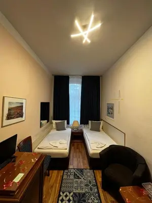 Ein Bett oder Betten in einem Zimmer der Unterkunft Pension Oase