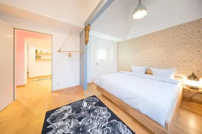 Ein Bett oder Betten in einem Zimmer der Unterkunft Design Apartments - 