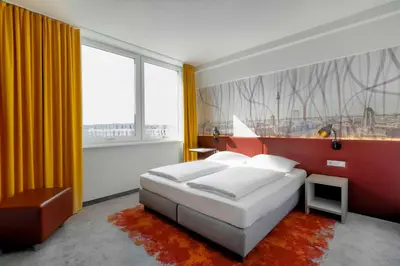Ein Bett oder Betten in einem Zimmer der Unterkunft Campanile Berlin Brandenburg Airport