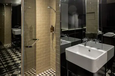 Ein Badezimmer in der Unterkunft Hotel MANI by AMANO