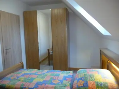 Ein Bett oder Betten in einem Zimmer der Unterkunft NR- Fewo mit Ladestation für E-Autos