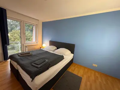 Ein Bett oder Betten in einem Zimmer der Unterkunft Moderne Wohnungen im Dachgeschoss
