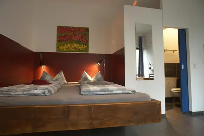 Ein Bett oder Betten in einem Zimmer der Unterkunft Pension Mädchenkammer