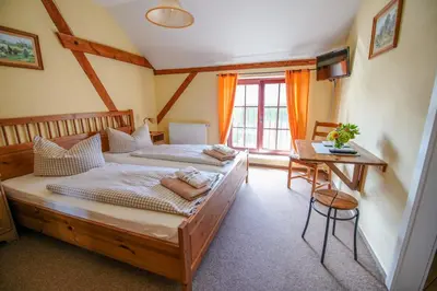Ein Bett oder Betten in einem Zimmer der Unterkunft Scheunenherberge