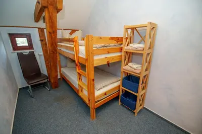 Ein Etagenbett oder Etagenbetten in einem Zimmer der Unterkunft Scheunenherberge