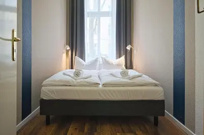 Ein Bett oder Betten in einem Zimmer der Unterkunft Quiet Courtyard Apartment (PB1)