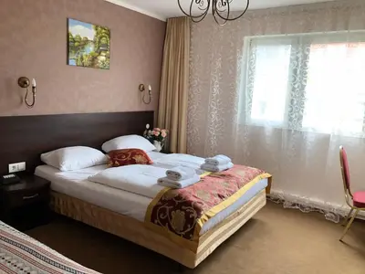 Ein Bett oder Betten in einem Zimmer der Unterkunft Atlas Berlin Hotel