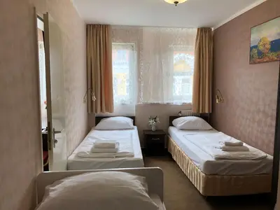 Ein Bett oder Betten in einem Zimmer der Unterkunft Atlas Berlin Hotel