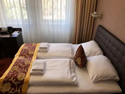 Ein Bett oder Betten in einem Zimmer der Unterkunft Atlas Berlin Hotel