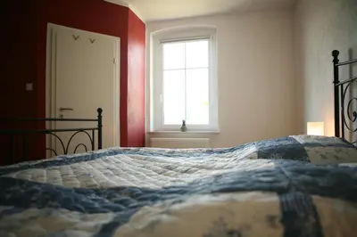 Ein Bett oder Betten in einem Zimmer der Unterkunft Pension Gestüt Lindenhof