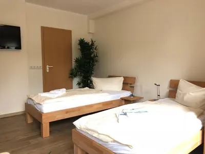 Ein Bett oder Betten in einem Zimmer der Unterkunft Apart Pension Plaue