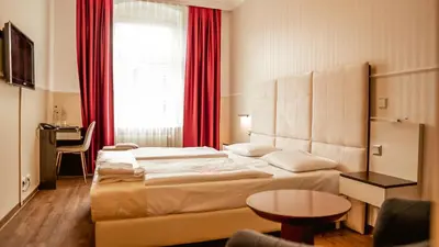 Ein Bett oder Betten in einem Zimmer der Unterkunft Hotel Prens Berlin