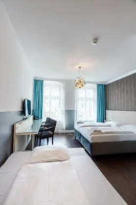 Ein Bett oder Betten in einem Zimmer der Unterkunft Hotel Prens Berlin