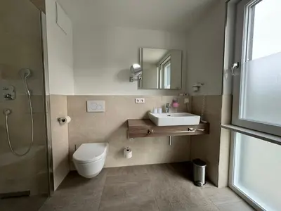 Ein Badezimmer in der Unterkunft Fontane Hotel