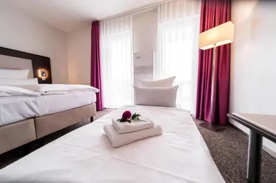 Ein Bett oder Betten in einem Zimmer der Unterkunft Fontane Hotel