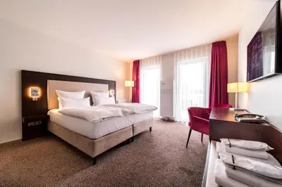 Ein Bett oder Betten in einem Zimmer der Unterkunft Fontane Hotel