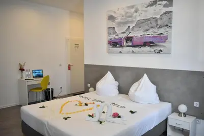 Ein Bett oder Betten in einem Zimmer der Unterkunft Motel Schönefeld
