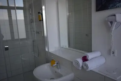 Ein Badezimmer in der Unterkunft Motel Schönefeld