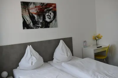 Ein Bett oder Betten in einem Zimmer der Unterkunft Motel Schönefeld