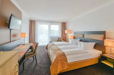 Ein Bett oder Betten in einem Zimmer der Unterkunft Hotel Markgraf