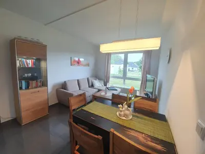 Ein Sitzbereich in der Unterkunft Apartment zum Strand