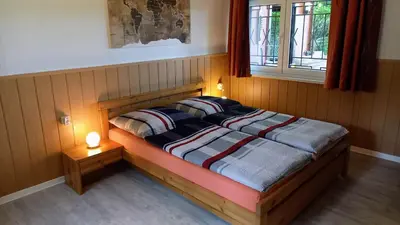 Ein Bett oder Betten in einem Zimmer der Unterkunft Ferienhaus direkt am See