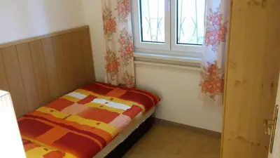 Ein Bett oder Betten in einem Zimmer der Unterkunft Ferienhaus direkt am See