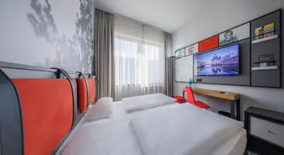 Ein Bett oder Betten in einem Zimmer der Unterkunft Hotel Lützow