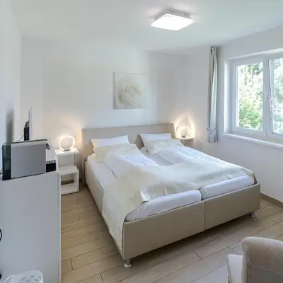 Ein Bett oder Betten in einem Zimmer der Unterkunft Pension am See