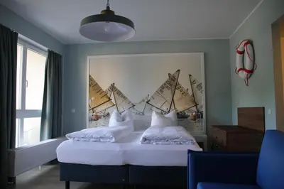 Ein Bett oder Betten in einem Zimmer der Unterkunft Havelhotel