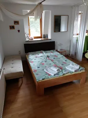 Ein Bett oder Betten in einem Zimmer der Unterkunft Kräuter-Heidi