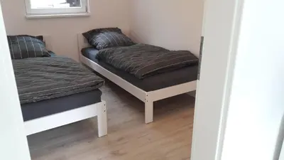 Ein Bett oder Betten in einem Zimmer der Unterkunft Cottage am Wald bei Berlin