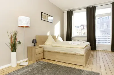 Ein Bett oder Betten in einem Zimmer der Unterkunft BearlinCity Apartments - City Center West