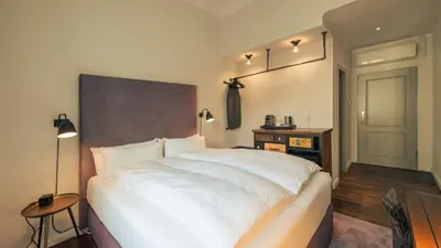Ein Bett oder Betten in einem Zimmer der Unterkunft Bob W Berlin Mitte