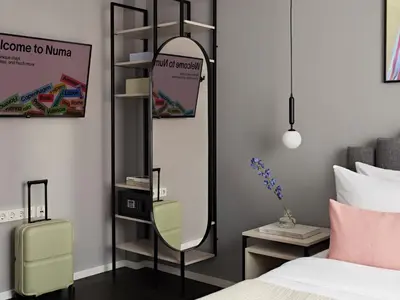 Ein Bett oder Betten in einem Zimmer der Unterkunft Numa Berlin Boxer
