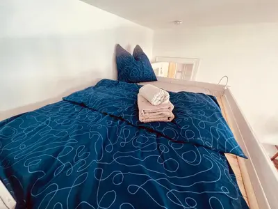 Ein Bett oder Betten in einem Zimmer der Unterkunft Golden Loft Berlin