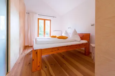 Ein Bett oder Betten in einem Zimmer der Unterkunft Dreigärten Brodowin