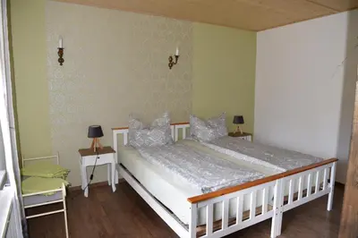 Ein Bett oder Betten in einem Zimmer der Unterkunft Ferienwohnung am Netzener See
