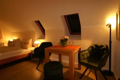 Ein Bett oder Betten in einem Zimmer der Unterkunft Zur Schönen Aussicht