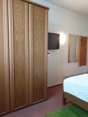 Ein Bett oder Betten in einem Zimmer der Unterkunft Pension Am Mellensee