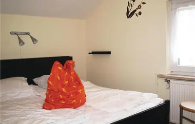 Ein Bett oder Betten in einem Zimmer der Unterkunft Two-Bedroom Holiday Home In Neue Muhle